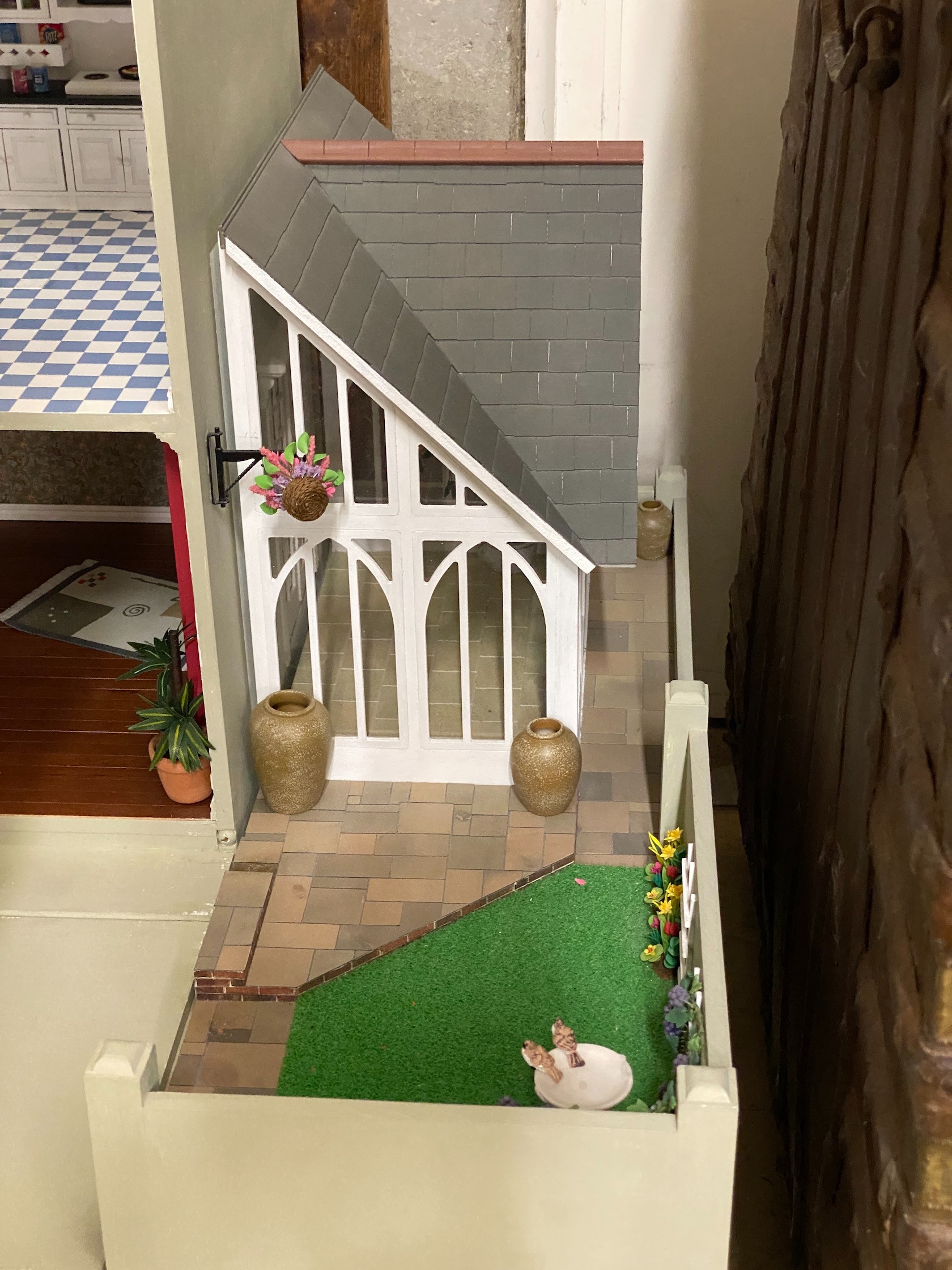 A good quality modern painted wood doll's house, modelled as a Victorian four storey villa, width 76cm, depth 73cm, height 150cm